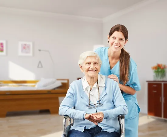 Senior woman in a wheelchair receiving care and support from a nurse