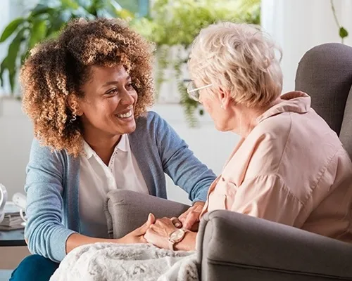 Friendly caregiver building trust and companionship with a senior resident