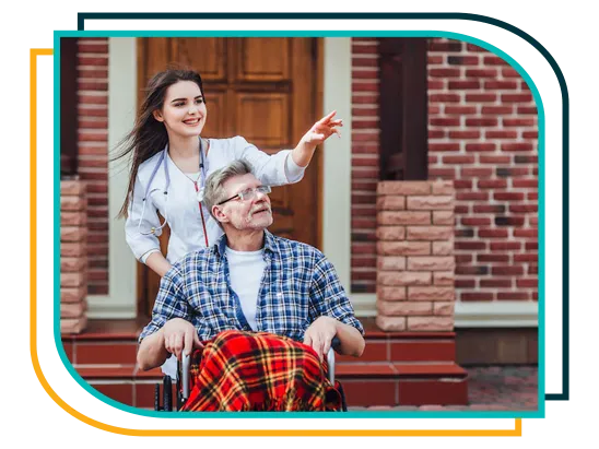 Caregiver helping an elderly resident in a wheelchair at an assisted living community in Maryland